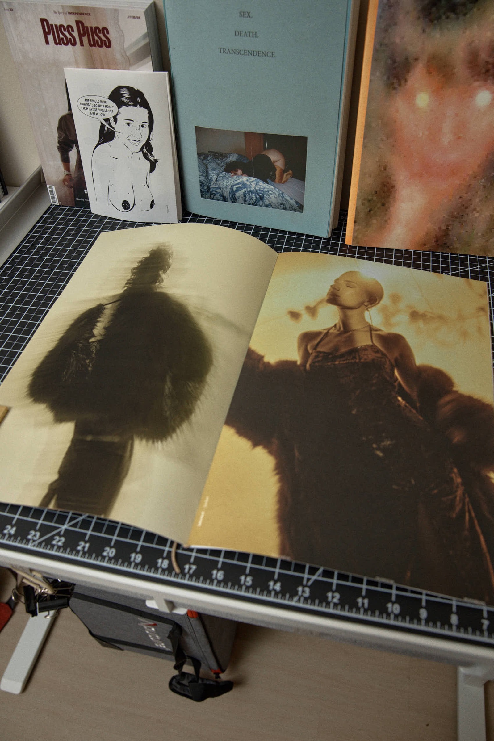 Open book spread, silhouette in fur and figure looking skyward