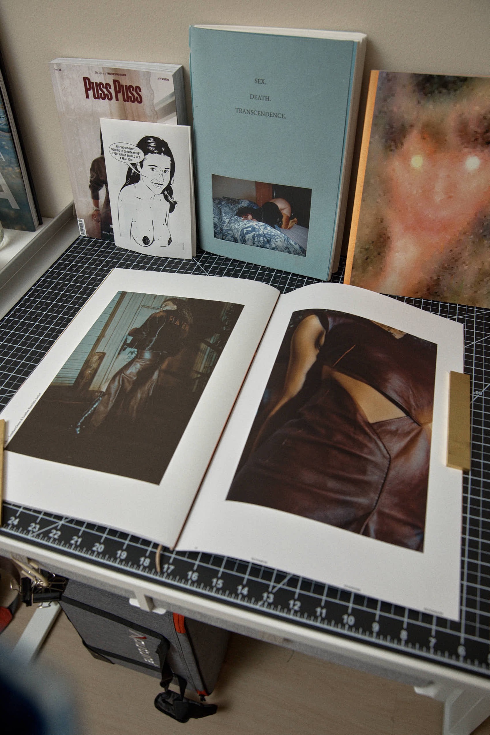 Open book spread, leather jacket portrait and detail