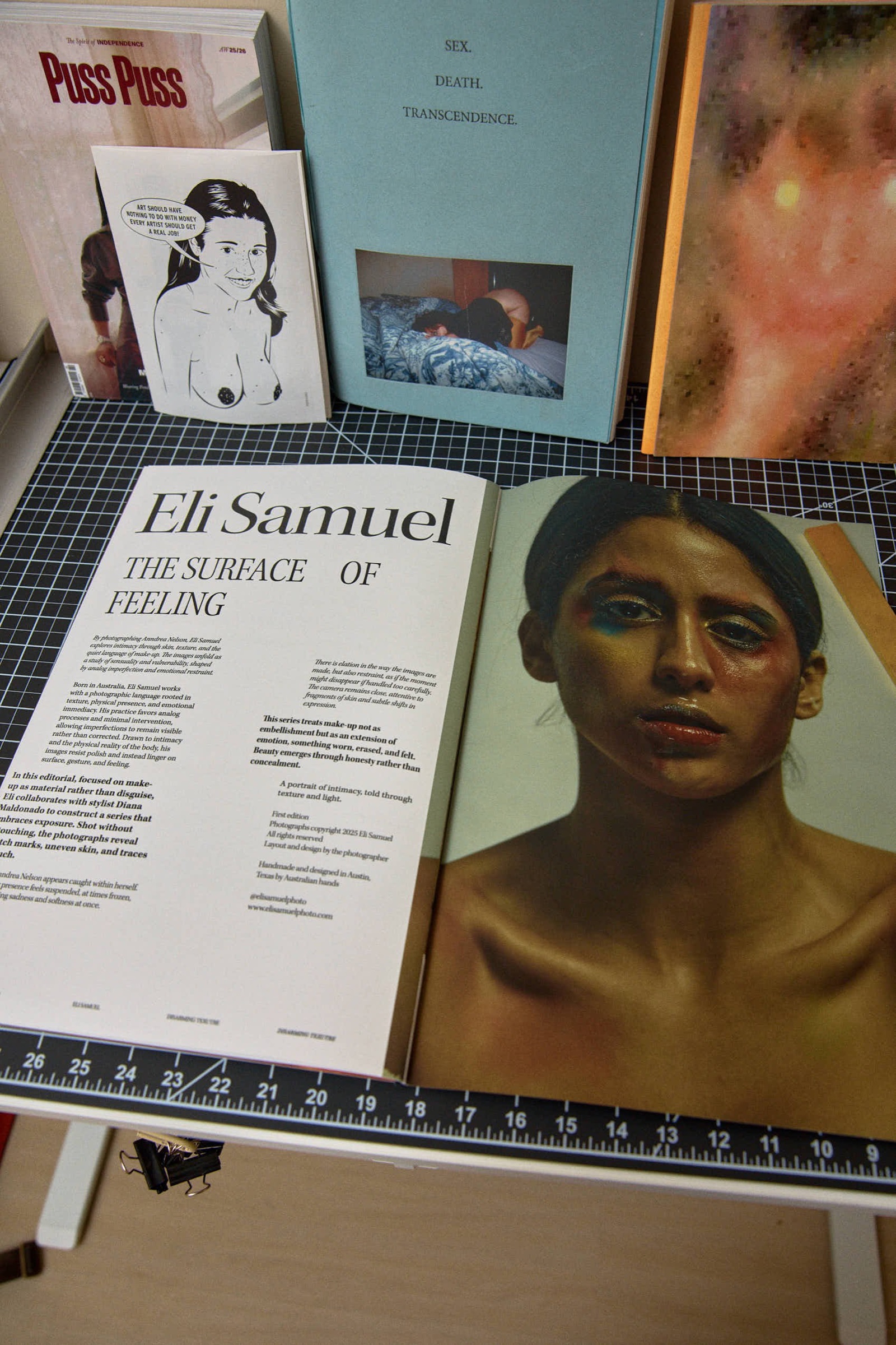 Open book spread, title essay and gold-lit portrait