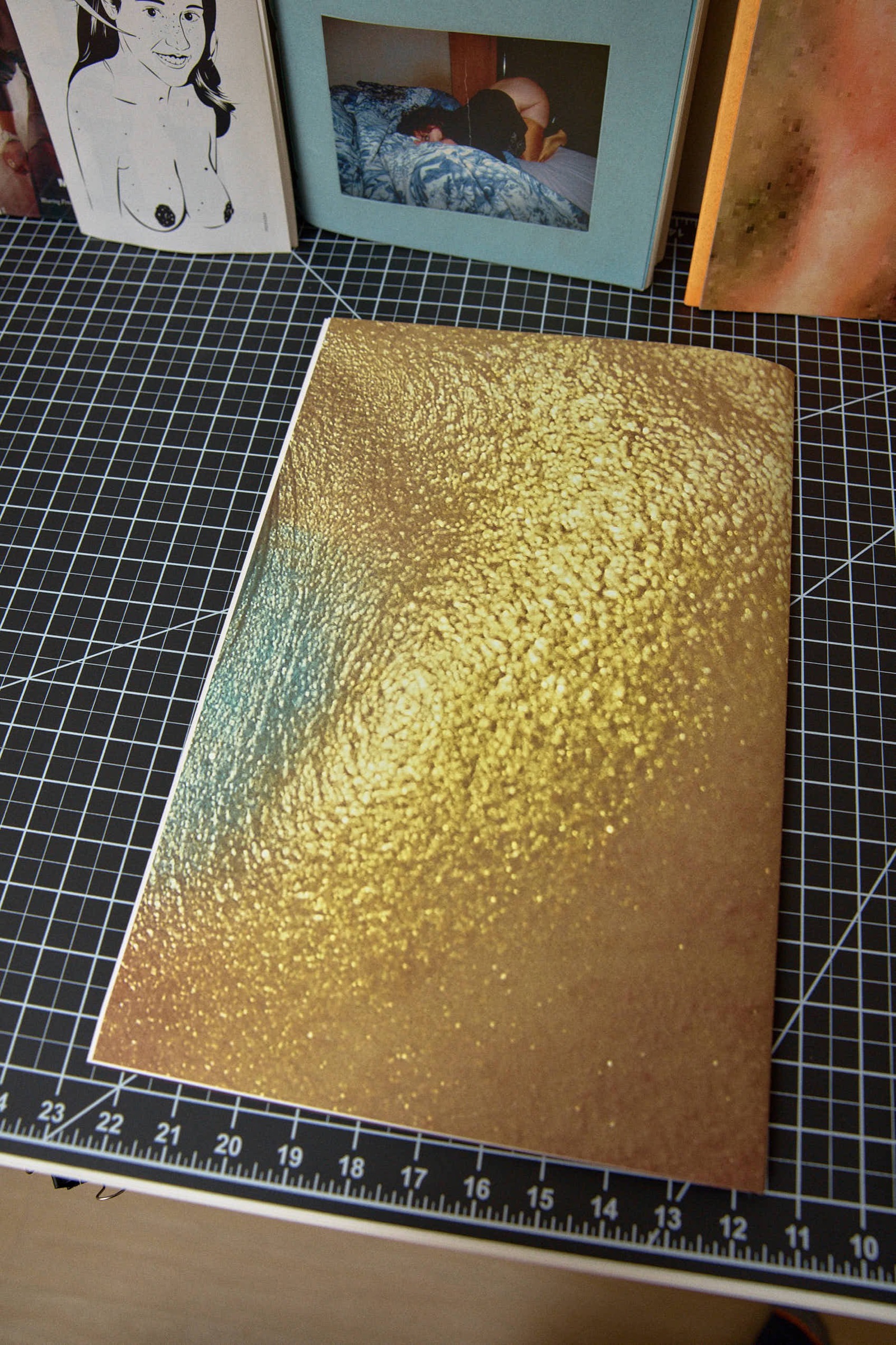 Close-up of gold glitter texture, back cover