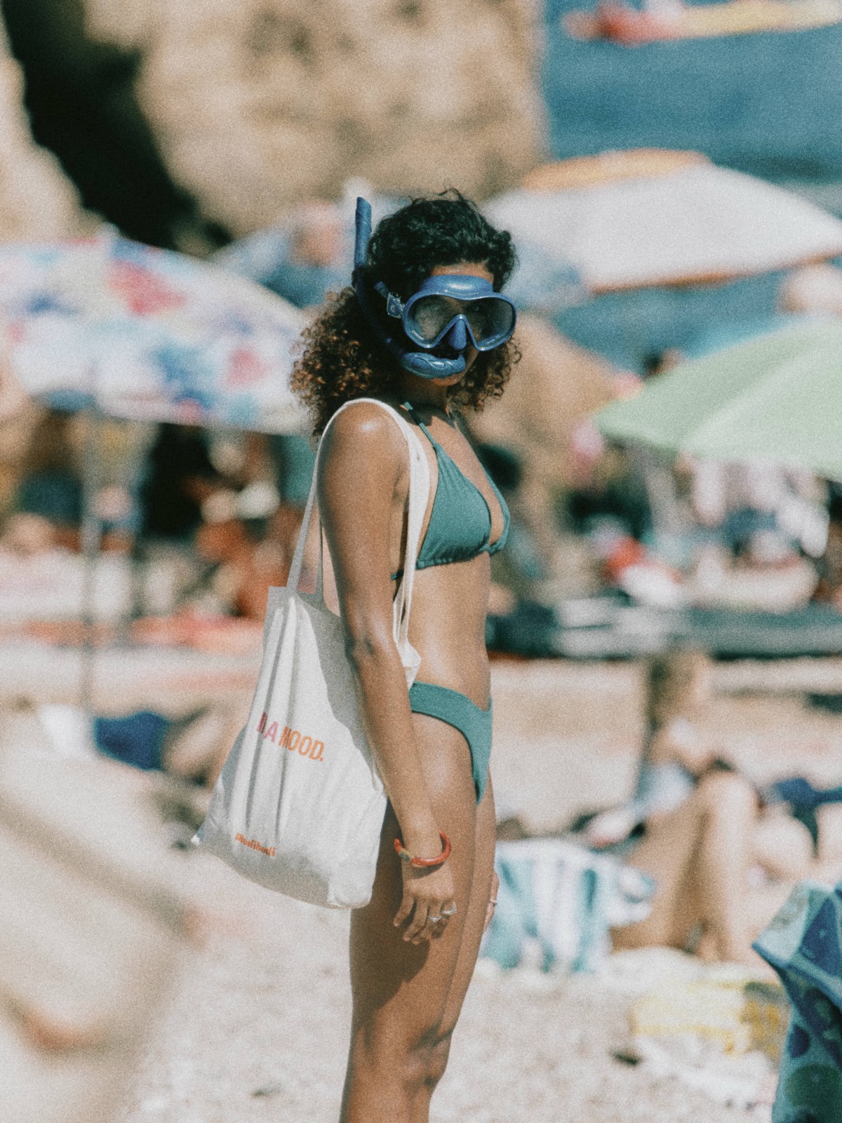 Model Zaya Sabara wearing a snorkel mask at the beach, Tossa de Mar, Spain, Summer 2026, photographed by Eli Samuel for Modibodi Swim.